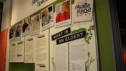 A centerpiece placard of "Hello Auntie, Hello Uncle" explores what role elders hold and features six elders including Dorothy Quock, Masood Rubb, Amy Nikaitani, Dorothy Cordova, Noe Noe Wong Wilson, and Allan Louie. (Photo: Agueda Pacheco Flores)