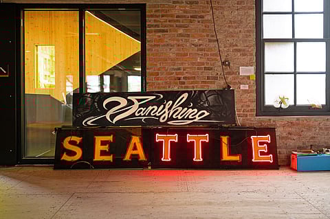 Vanishing Seattle's new book 'Signs of Vanishing Seattle' documents signage from beloved businesses of our city's past. (Photo by Gavin Argo, courtesy of Vanishing Seattle.)