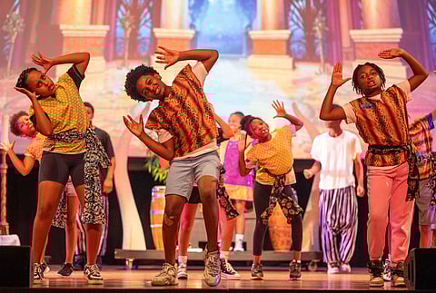 The servants entertain Madame President while slipping in a little of their own "she's cuckoo and crazy" into the performance. (Photo: Susan Fried)