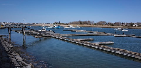 Empty docks floating in the water in Scituate