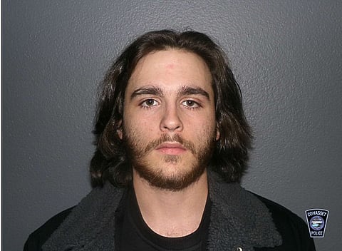 Police mug shot of a bearded man