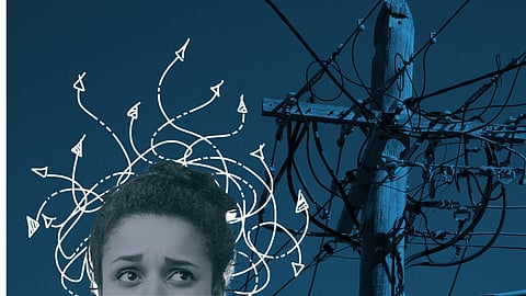 A confused looking women superimposed over a mess of wires on a utility pole.