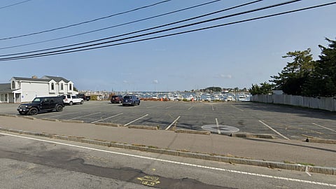 Image of the property 44 Jericho Road in Scituate- which is mostly parking spaces and a parking lot near the Scituate Harbor.