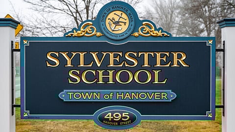 Picture of the Sylvester school sign- Hanover Select Board discusses ARPA fund loss and considers calling Plymouth County officials to explain reimbursement denial.