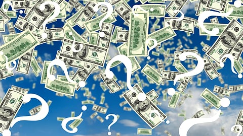 money flies through the blue sky covered in white question marks