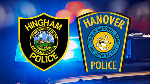 Blue lights on the top of a police car with the badges from the Hingham MA police and the Hanover MA police. Police arrested a Hanover man in connection with alleged upskirting incidents at Hingham stores.