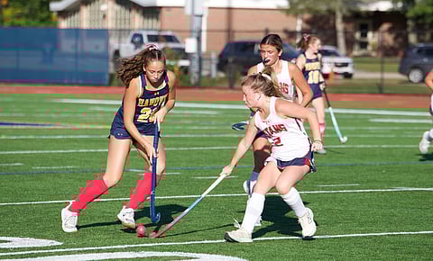 High school girls playing field hockey in Hanover