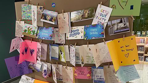Birthday cards for the Norwell Public Library on a display board