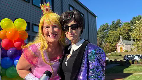 A woman dressed as princess peach from Mario and a woman dressed as Kris Jenner pose.