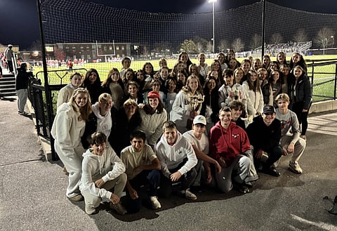 The team poses with their trophies from this season.