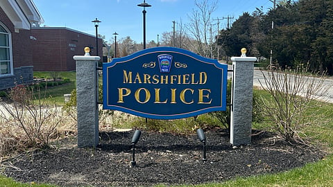 picture of marshfield massachusetts police station sign- blue sign with gold lettering