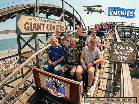 wooden rollercoaster with a bunch of guys riding it