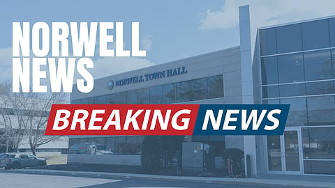 image of norwell town hall a white modern building with breaking news written across it