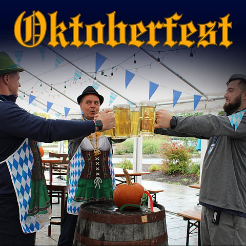 promo poster for Oktoberfest at Starland with 3 men cheersing beer steins