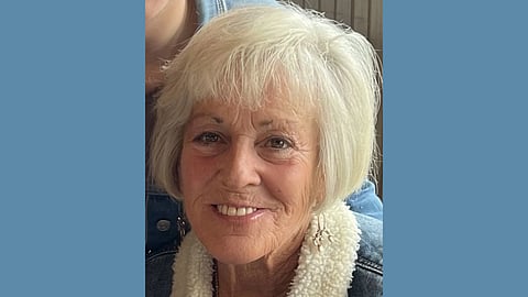 Older white woman with blonde hair wearing a denim jacket with lambswool collar