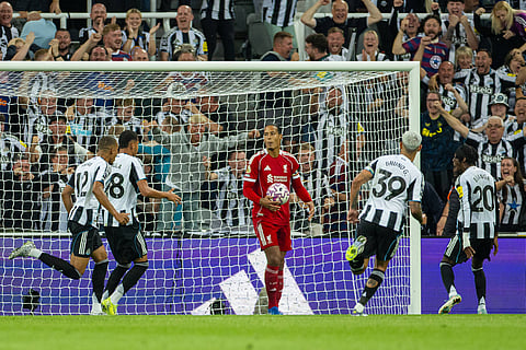 Virgil van Dijk of Liverpool looks dejected after his side conceded the equalizing goal against Newcastle