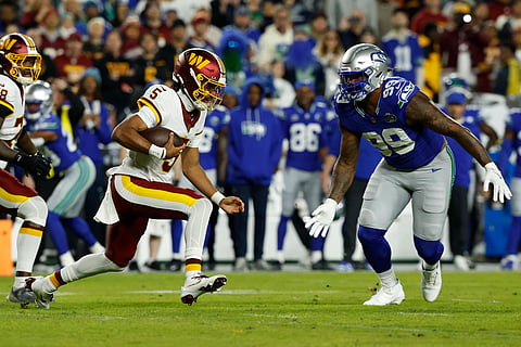 Seattle Seahawks and Washington Commanders players in action