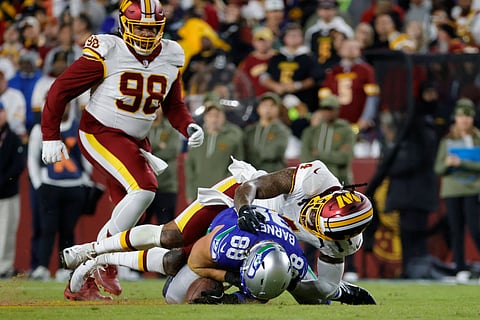 Frankie Luvu tackles an opponent