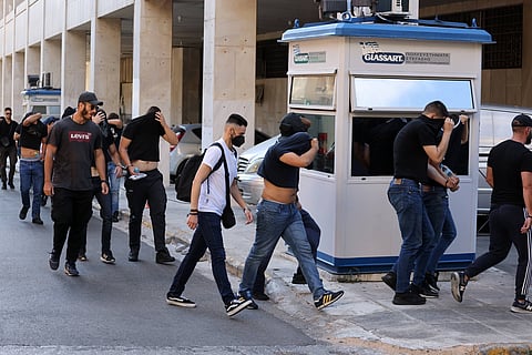 Croatian soccer fans escorted by police in Greece in 2023 after violence