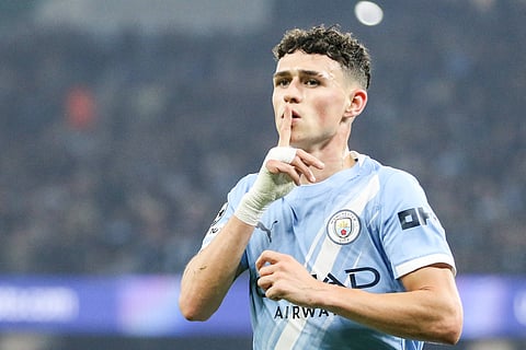 Phil Foden celebrates after scoring against Borussia Dortmund