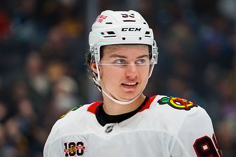 Connor Bedard smiles during a game