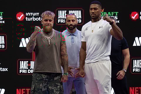 Anthony Joshua and Jake Paul in a press conference