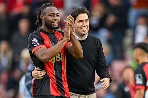 Andoni Iraola and Antoine Semenyo applaud the fans at the Vitality Stadium
