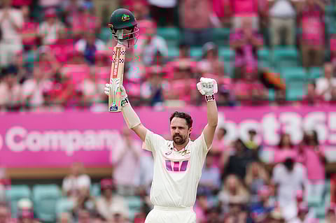 Travis Head celebrates scoring a century in the fifth Ashes Test