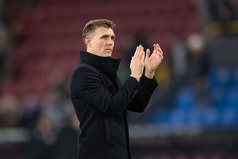 Manchester United interim manager Darren Fletcher applauds the visiting fans at Turf Moor