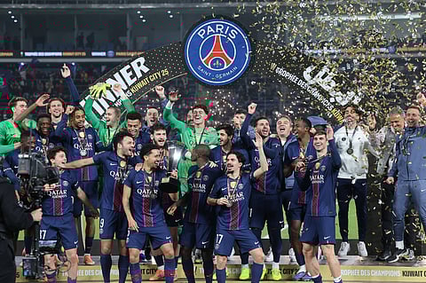 Paris Saint-Germain players pose with the French Super Cup title