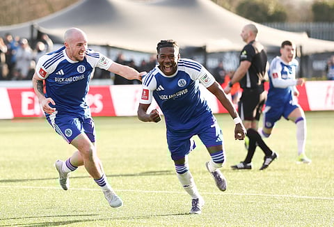 Macclesfield players celebrate after their goal against Crystal Palace