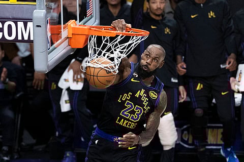 LeBron James dunks against Atlanta Hawks