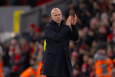 Arne Slot applauds the fans at Anfield