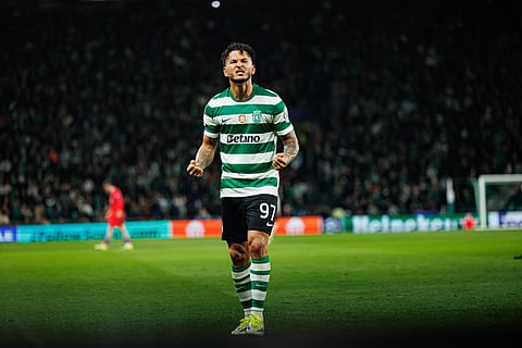 Luis Suarez celebrates his goal against Sporting Lisbon