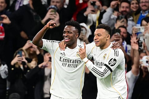 Vinicius Jr and Kylian Mbappe celebrate Real Madrid's goal against Monaco