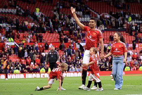 Casemiro waves to fans at Stretford End