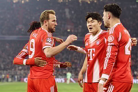 Harry Kane celebrates his goal with teammates