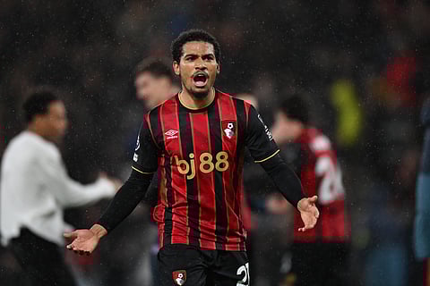 Amine Adli celebrates at full time against Liverpool