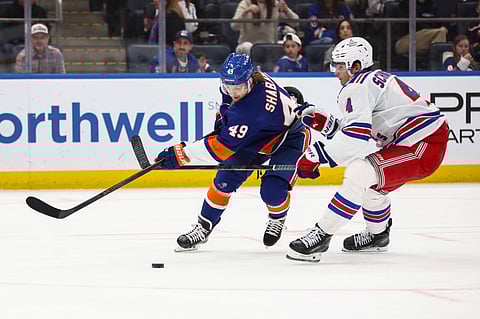 New York Islanders and New York Rangers players in action
