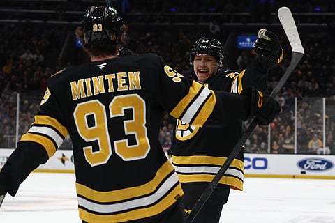 Boston Bruins players Fraser Minten and Hampus Lindholm