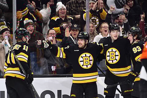 Boston Bruins players celebrate their goal against Philadelphia Flyers