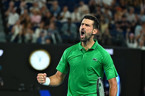 Novak Djokovic celebrates a point against Jannik Sinner