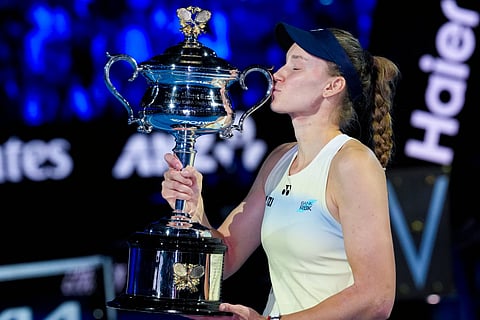 Champion Elena Rybakina kisses the Daphne AkhurstMemorial Cup