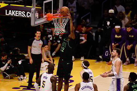 Derik Queen of New Orleans Pelicans slam dunks the ball during an NBA game