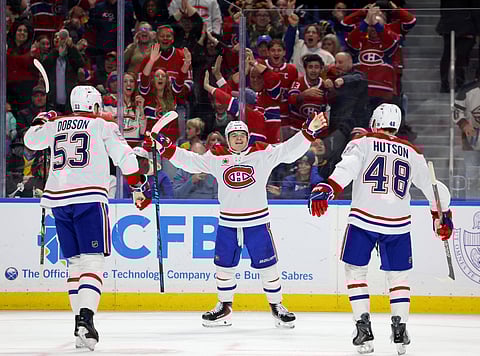 Montreal Canadiens players celebrate goal against Buffalo Sabres
