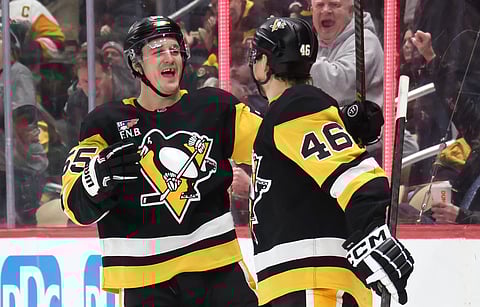 Pittsburgh Penguins' Noel Acciari celebrates his goal with Blake Lizotte