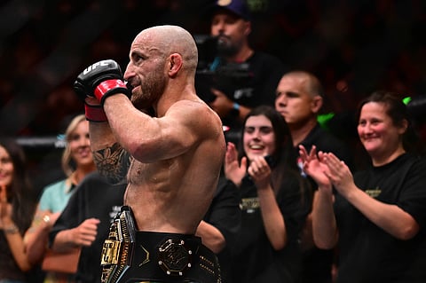 Alexander Volkanovski celebrates after his win over Diego Lopes