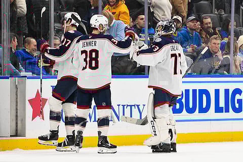 Columbus Blue Jackets players celebrate their win