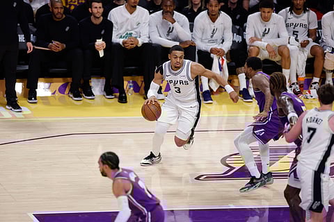 Keldon Johnson carries the ball forward for San Antonio Spurs