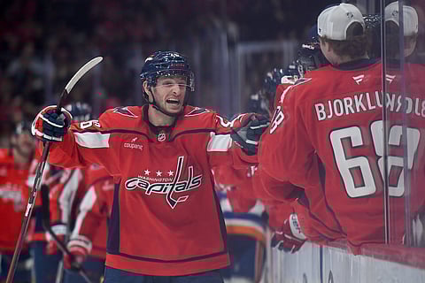 Washington Capitals players celebrate their goal